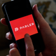 This illustration picture shows social media application logo from Parler displayed on a smartphone in Arlington, Virginia on July 2, 2020
